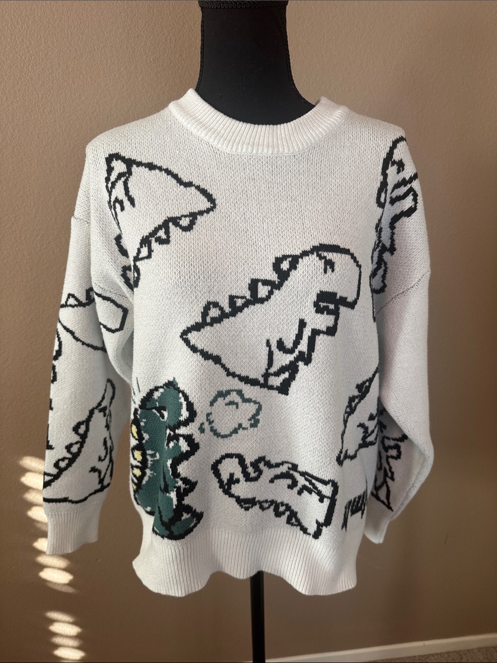 Unisex YWFG White Crewneck Sweater with Black Dino Outline and Green Accent